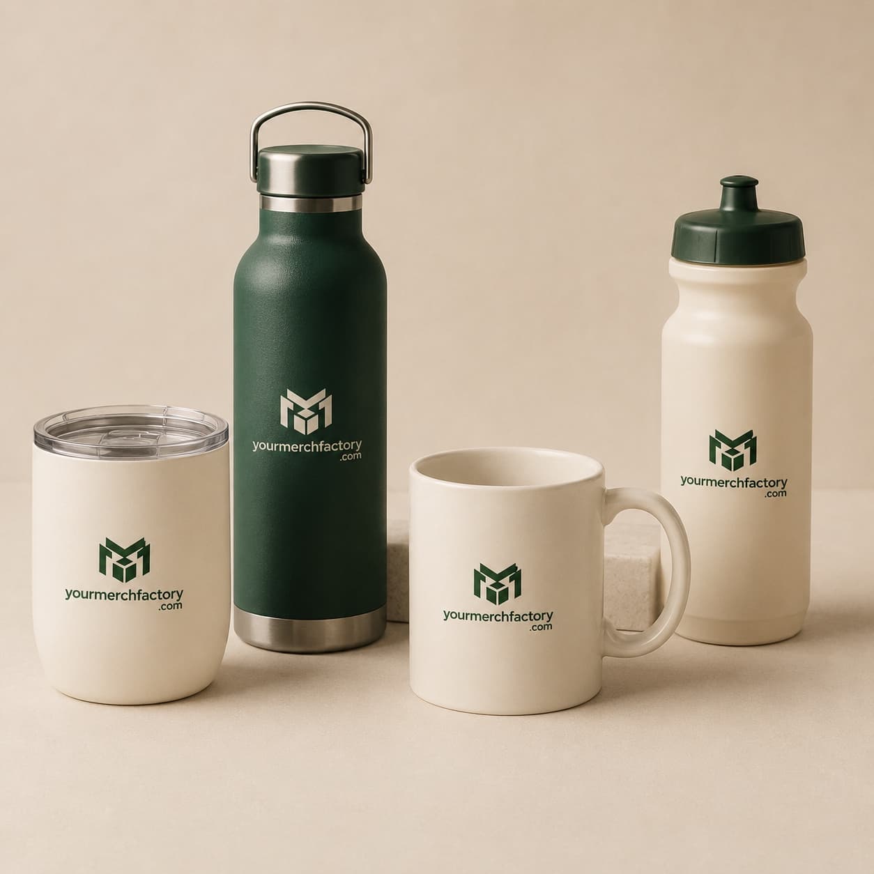 Custom branded stainless tumbler, water bottle, and ceramic mug on a clean surface