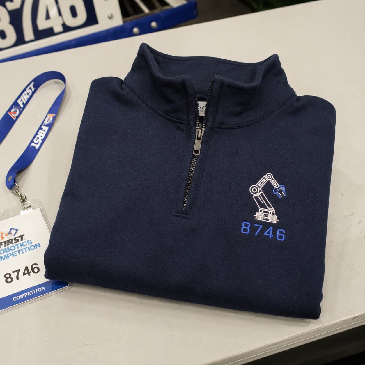 Quarter-zips for club officers and travel squads