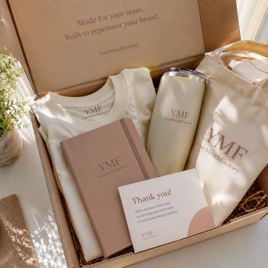 A packed welcome kit with branded sticker packs and accessories